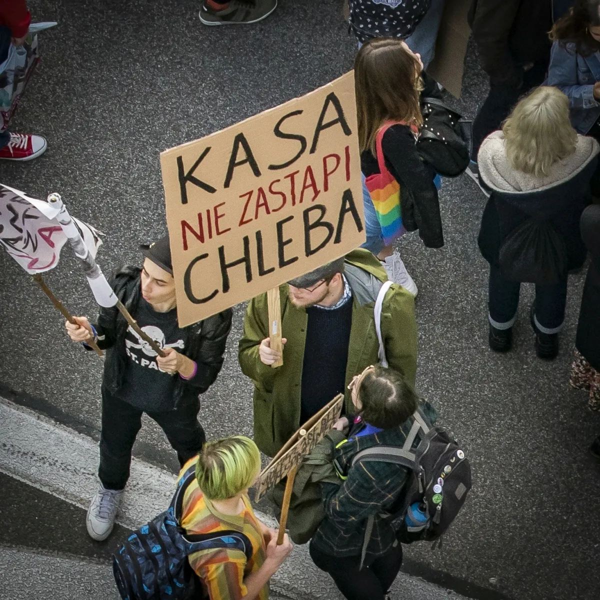 Protester holding a KASA NIE ZASTAPI CHLEBA sign seen from above